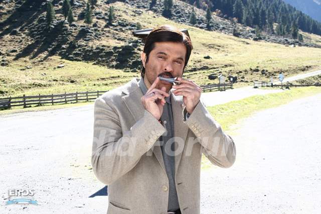 Anil Kapoor playing a harmonica