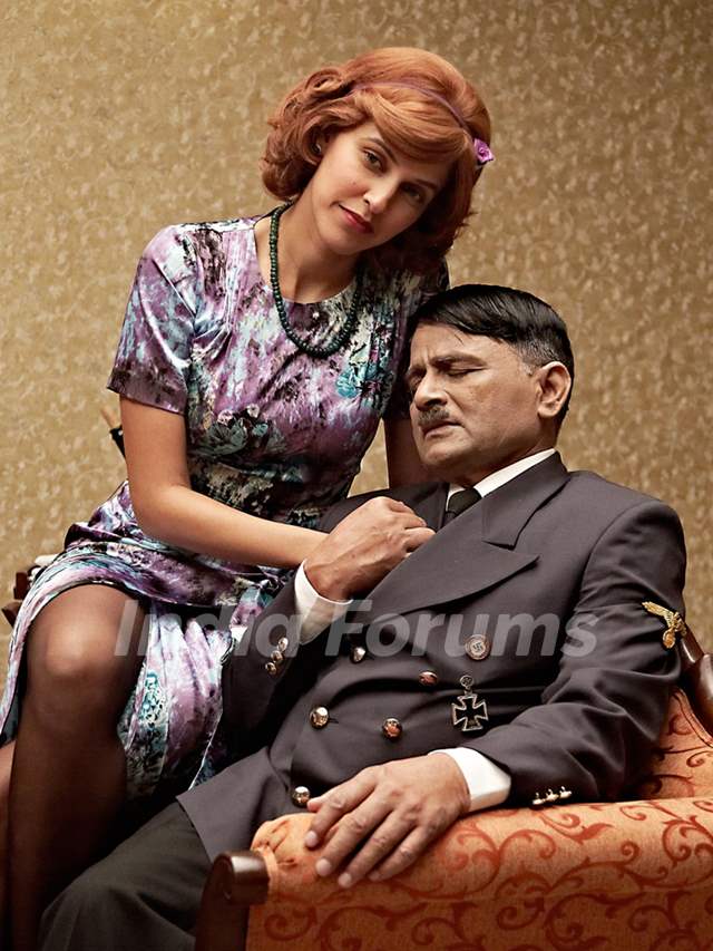 Raghuvir Yadav and Neha Dhupia in the movie Dear Friend Hitler