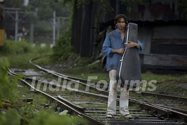 Shahid Kapoor standing on a railway track