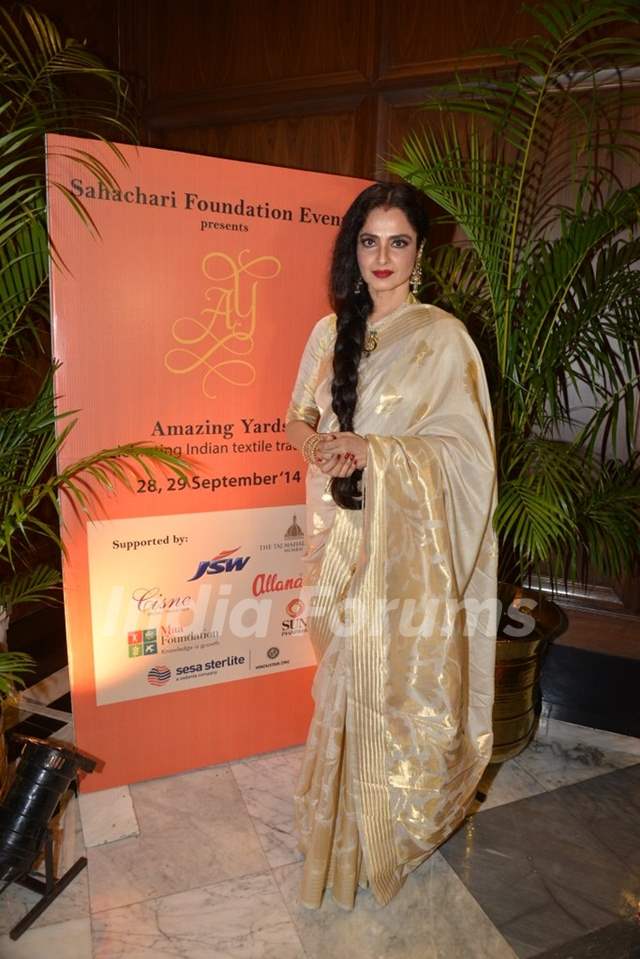 Rekha poses for the media at Sahachari Foundations Show for Tarun Tahiliani