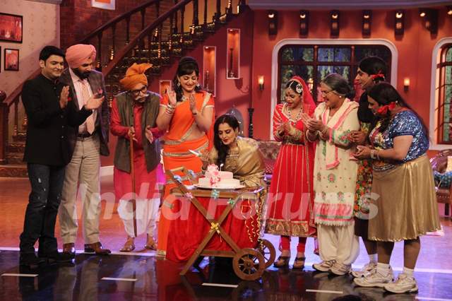 Rekha cuts a cake on Comedy Nights with Kapil
