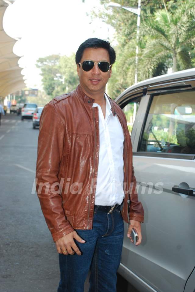 Madhur Bhandarkar poses for the media at Airport