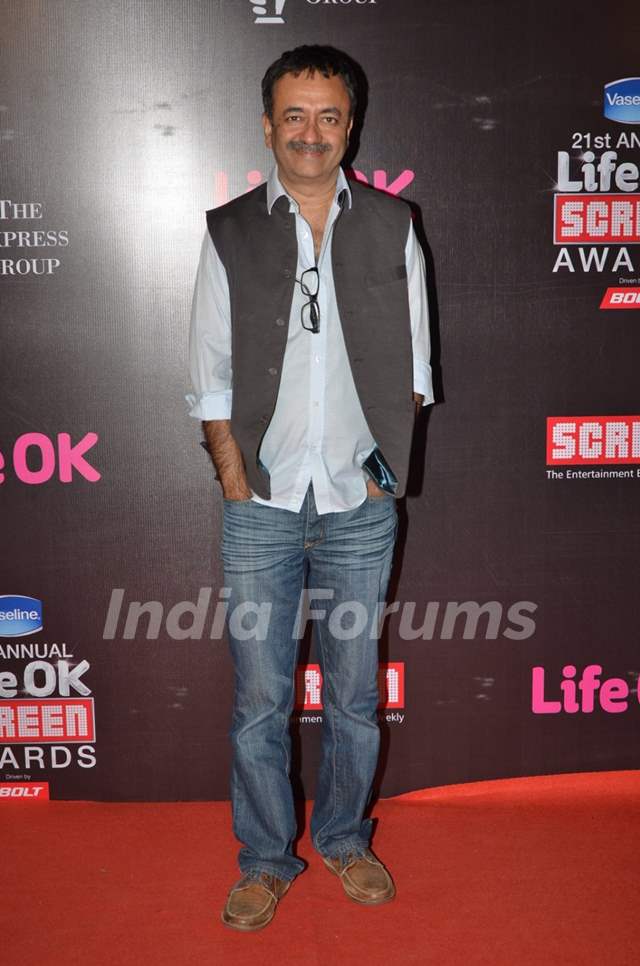 Rajkumar Hirani poses for the media at 21st Annual Life OK Screen Awards Red Carpet