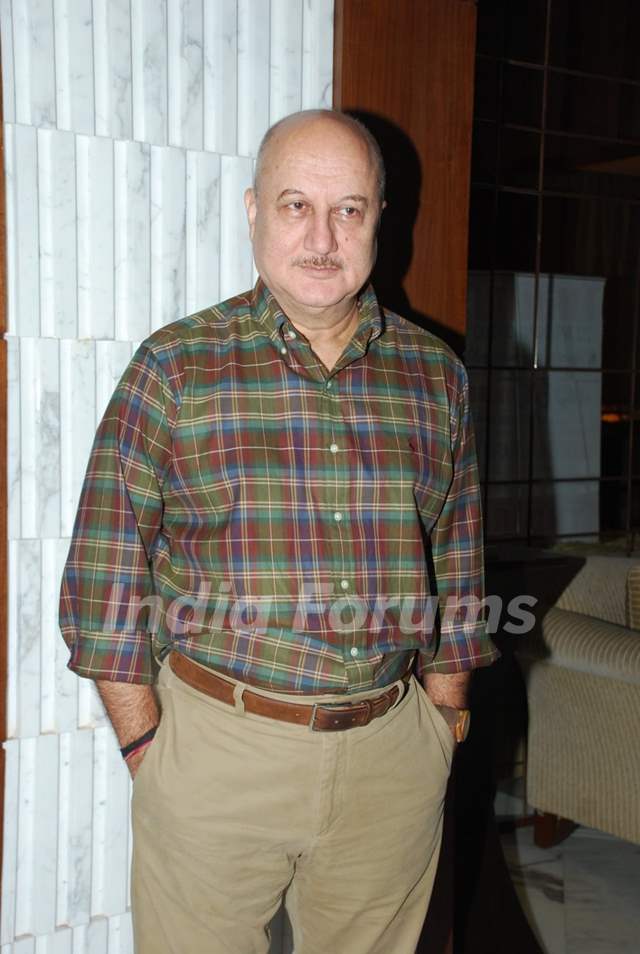 Anupam Kher poses for the media at Arya Babbar's Book Launch