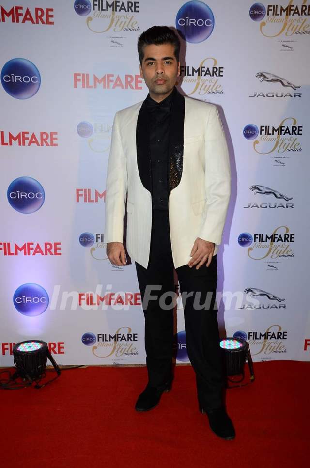 Karan Johar poses for the media at Filmfare Glamour and Style Awards