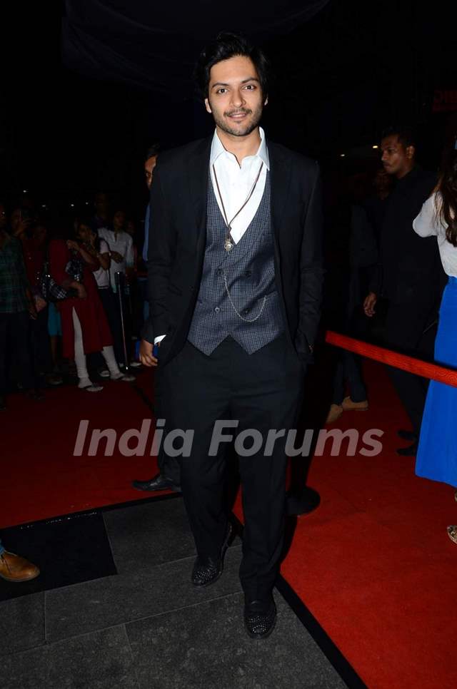 Ali Fazal poses for the media at the Premier of Fast & Furious 7
