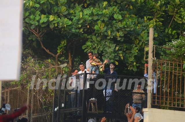 Shah Rukh Khan greets his fans with AbRam