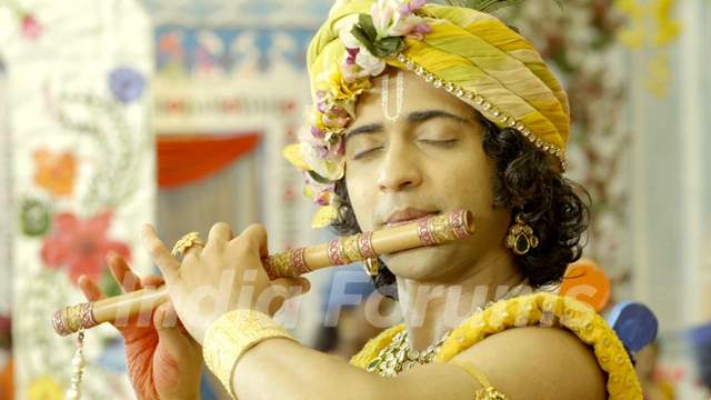 Sumedh as Krishna playing flute
