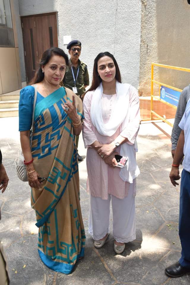 Hema Malini and her daughters were spotted outside polling centre