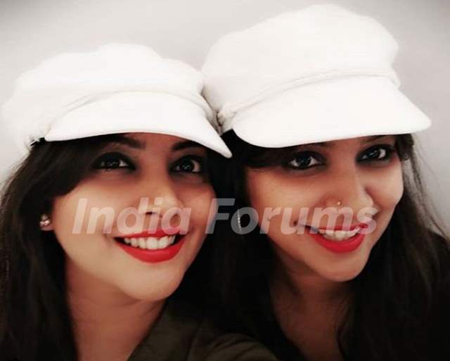 Nidhi Uttam with her twin sister