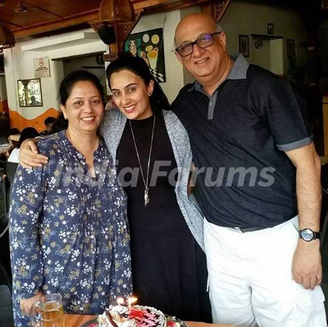 Sai Lokur with her parents