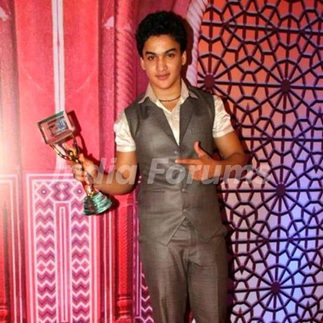 Faisal Khan with an award