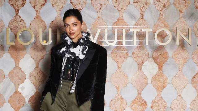 Deepika Padukone Is All Smiles 'Cruising' In An Oversized Black Coat And  Her Rs 3 Lakh Louis Vuitton Handbag At The LV Cruise 2023 Show