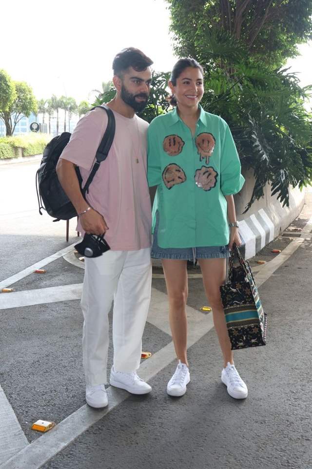 Anushka Sharma and Virat Kohli serve couple fashion goals with twinning  airport look - Video