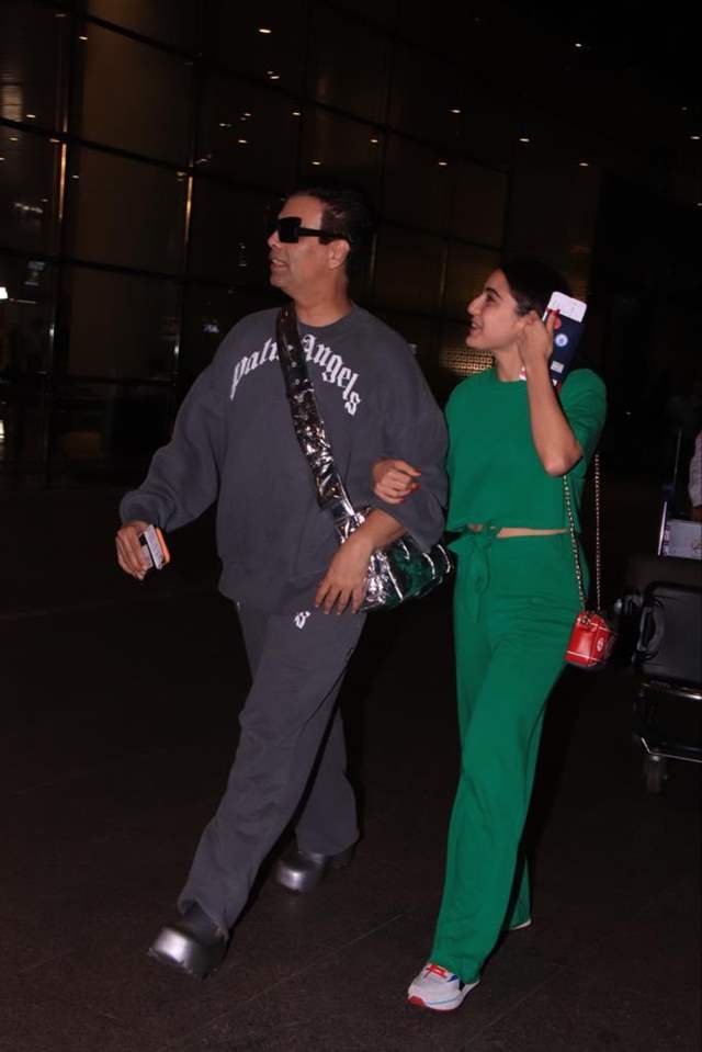 Karan Johar and Sara Ali Khan set airport style goals as they arrive  hand-in hand