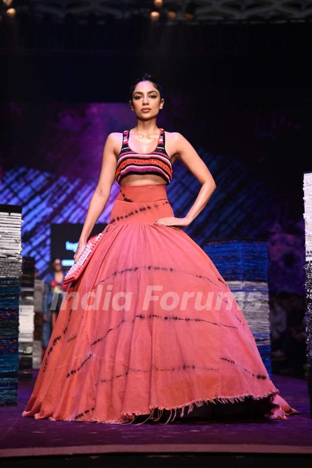Shobhita Dhulipala graced the ramp at the Lakme Fashion Week ina  structured pink tie-dye skirt paired with a beaded multi-coloured crop top.
