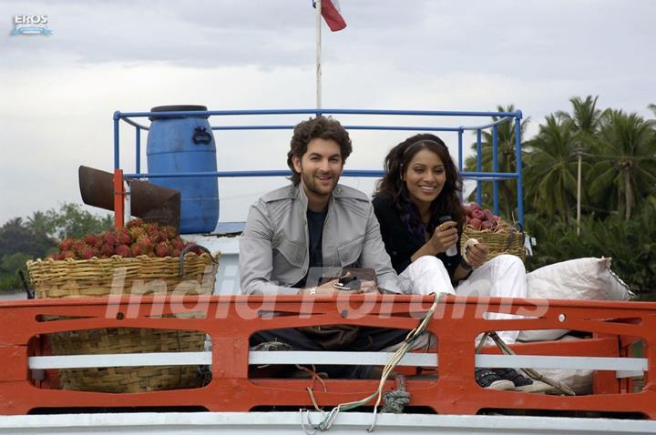 Neil and Bipasha sitting on a truck