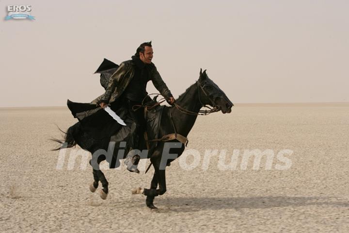 Kay Kay Menon sitting on a black horse