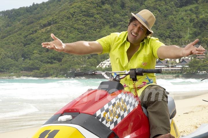 Govinda sitting on a motor bike