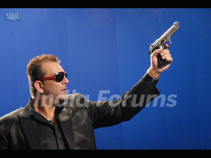 Sanjay Dutt aiming with a gun