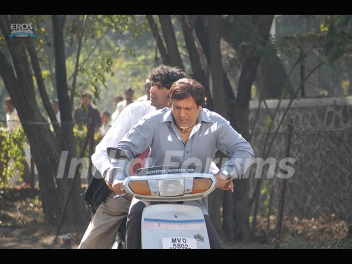 Govinda sitting on a motor bike
