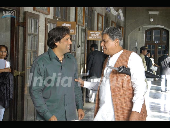 Om Puri talking to Govinda