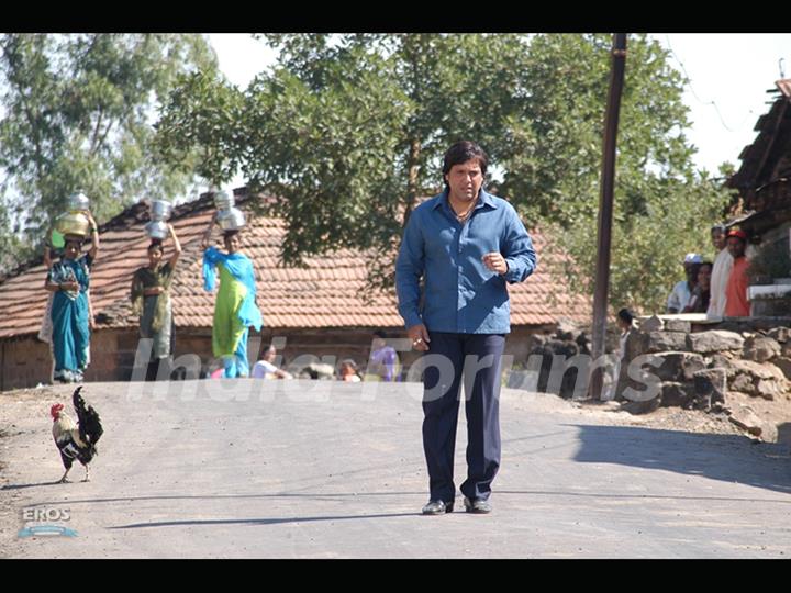 Govinda walking on a road