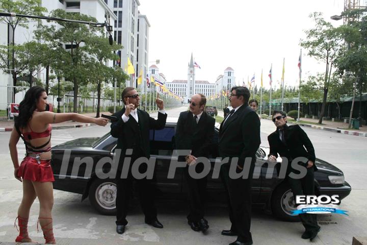 Satish,Gulshan and Anupam wearing a black suit