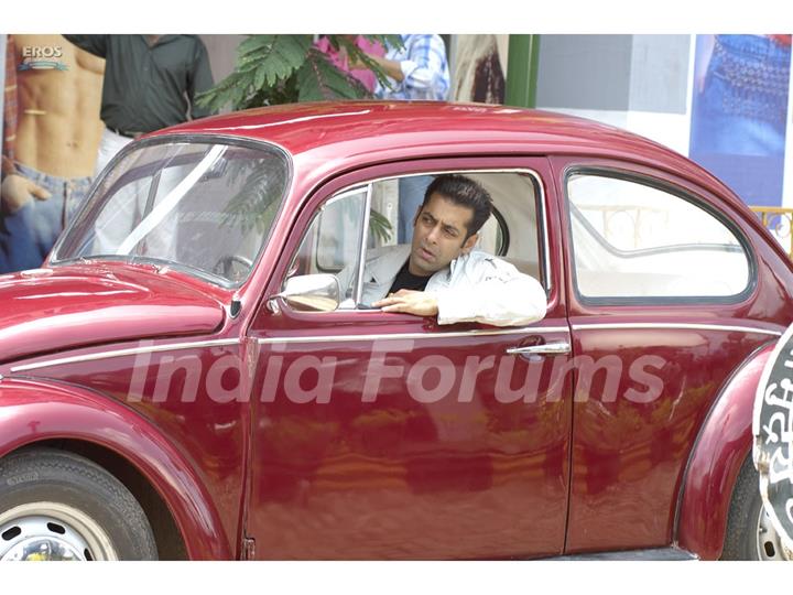 Salman Khan sitting on a car