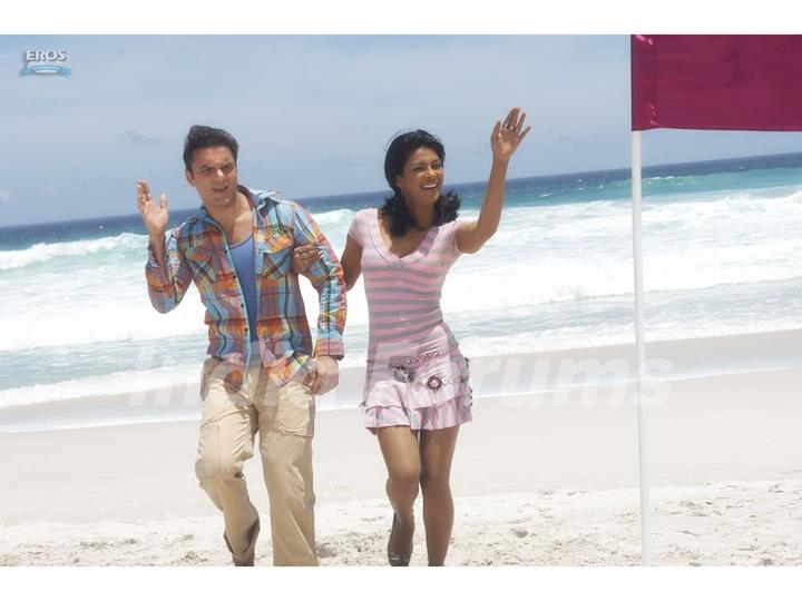 Sohail and Priyanka standing on a beach