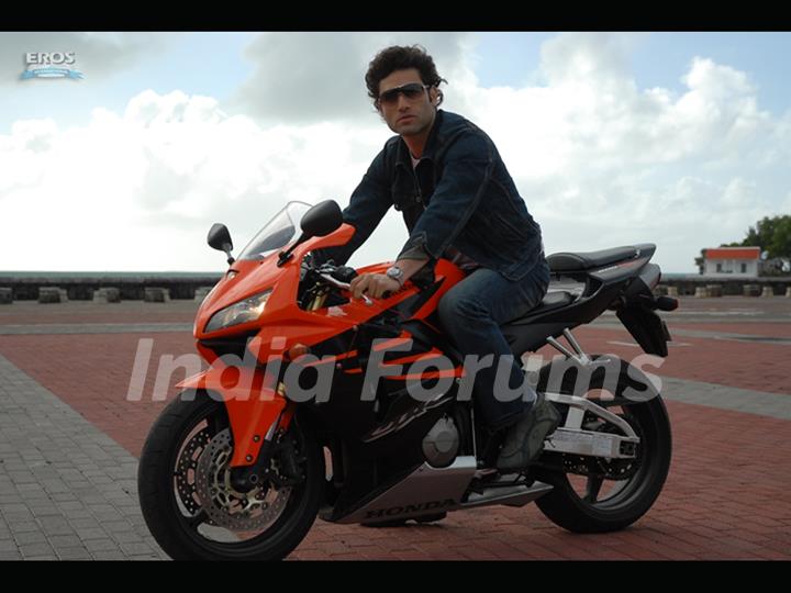 Shiney Ahuja sitting on a bike