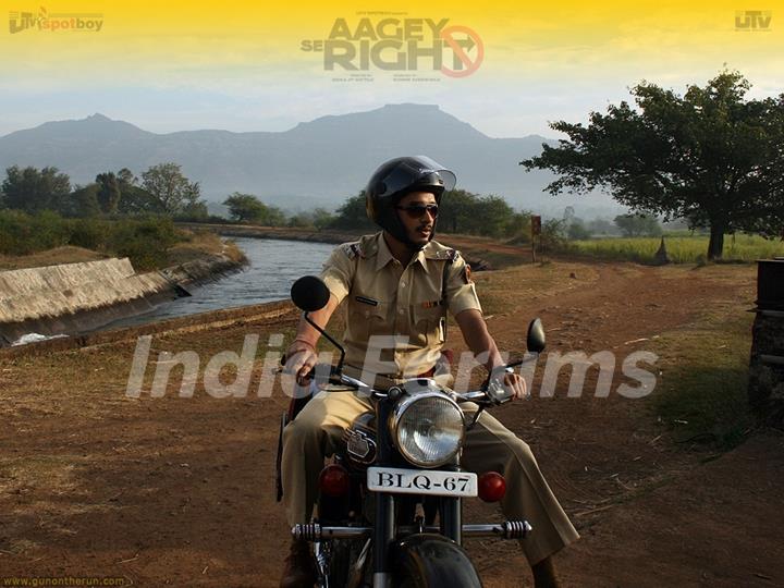 Shreyas Talpade sitting on a bike