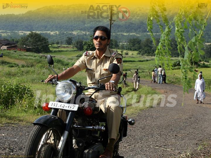 Shreyas Talpade riding a bike