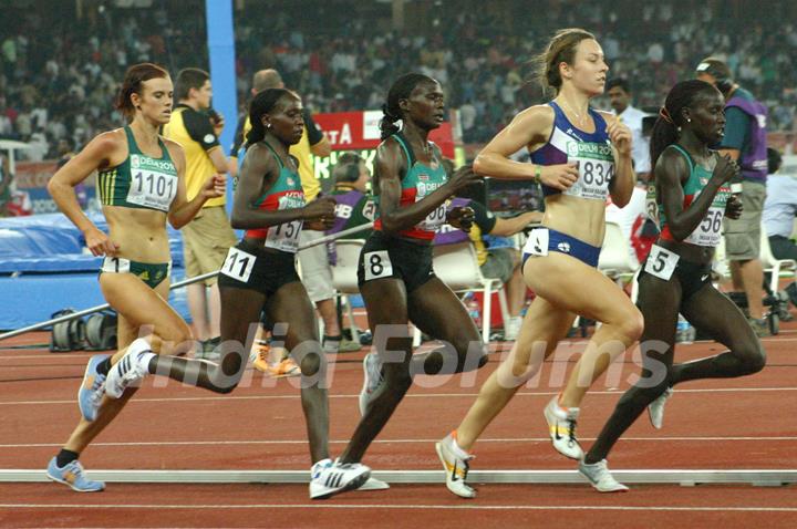 Gold medalist Vivian Cheruiyot of Kenya (1st from R)  Silver medalist Sylvia Kibet of Kenya (4th from R) and Bronze medalist Ines Chenonge of Kenya (3rd from R) during  the women's 5000 metres final at the 19th Commonwealth Games, in New Delhi