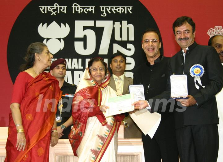 President Pratibha Patil presenting the Popular Film Award to Vidhu Vinod Chopra and Rajkumar Hirani for thier film