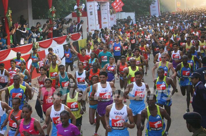 Participants during the Delhi Half Marathon, in New Delhi on Sunday