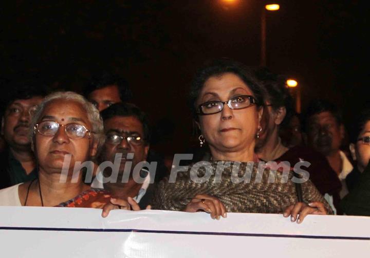 Eminent Tollywood actress Aparna Sen (R) famous social activist Medha Pathekar takes part in a protest rally to free Dr. Binayak Sen from jail in Kolkata on Monday late night. .