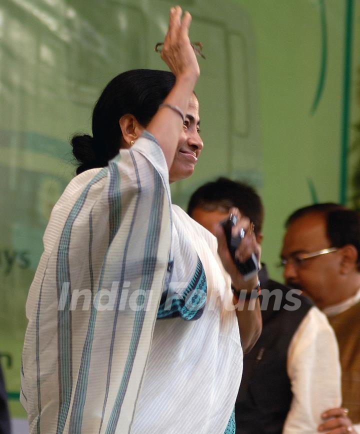 Railway minister Mamata Banerjee waves hands for the mass during a foundation stone laying function to confer the status of 17th Indipendent Zonal Railway in Kolkata and commencement of work for Joka-BBD Bag metro rail project (phase-1) of Joka ...