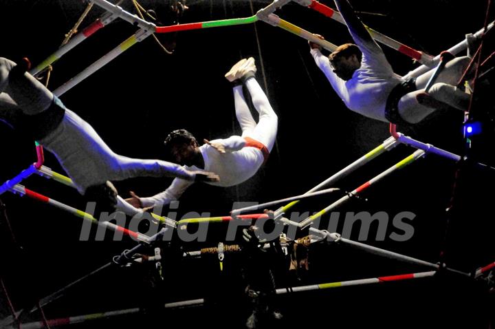 Kolkata: Circus performers perform skills during the trapeze round in Olympic Circus held in Kolkata in the eve of up coming New Year 2011, on Friday. .