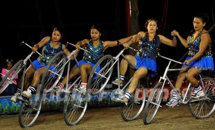 Kolkata: Circus performers perform skills during the cycle round in Olympic Circus held in Kolkata in the eve of up coming New Year 2011, on Friday. .