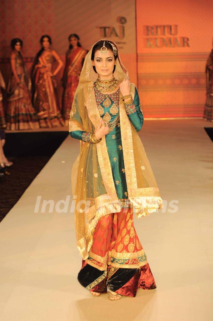 Dia Mirza walking on the ramp for Ritu Kumar fashion show at Taj land's End. .