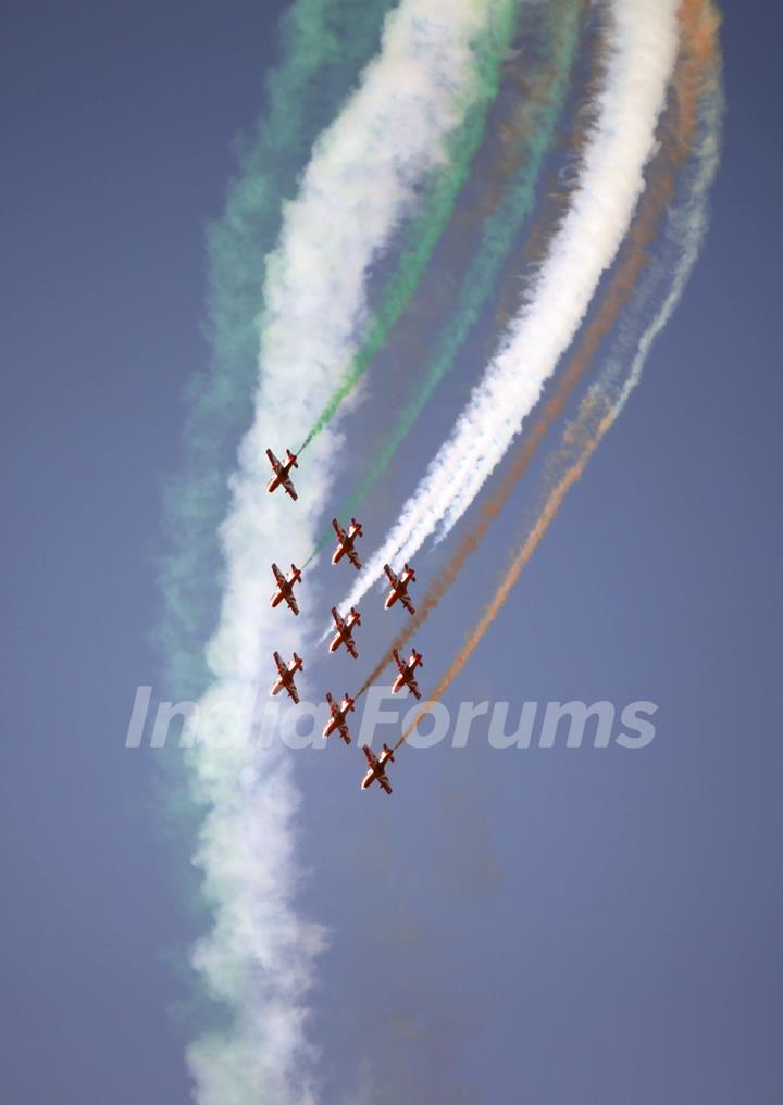 Surya Kiran team of Indian Air Force showing aerobatics at Aero India '11' in Bangalore. .