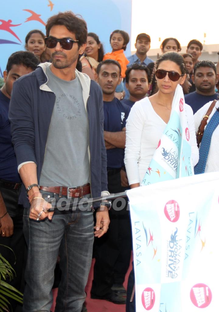 Arjun Rampal with wife at 'Lavasa Women’s Drive 2011' in Mumbai