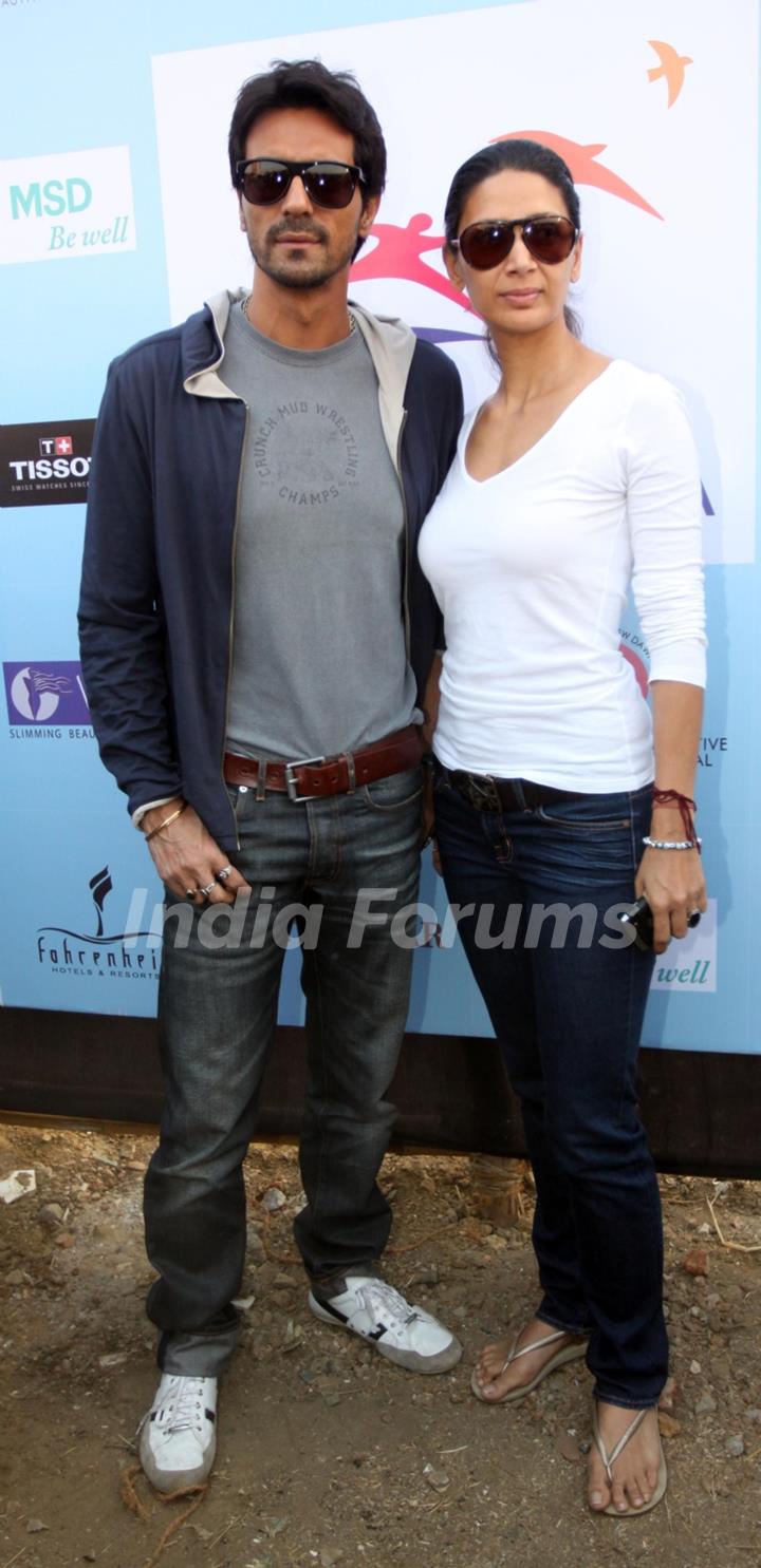 Arjun Rampal with wife at 'Lavasa Women’s Drive 2011' in Mumbai