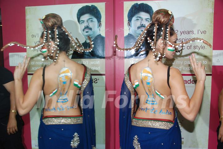 Sofiya Hayat gets her bare back painted at Shiva's saloon. .