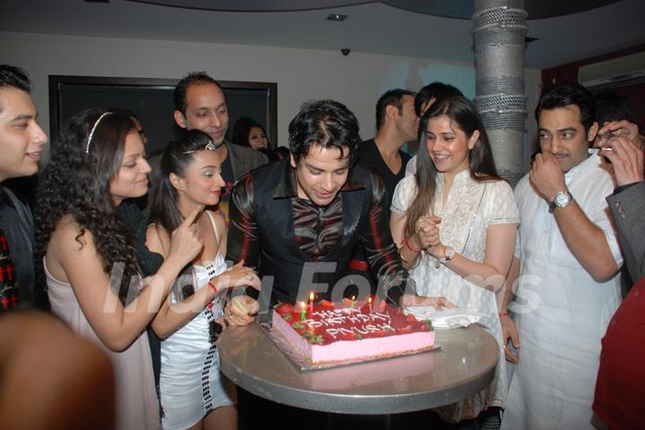 Piyush Sachdev cutting cake on his birthday