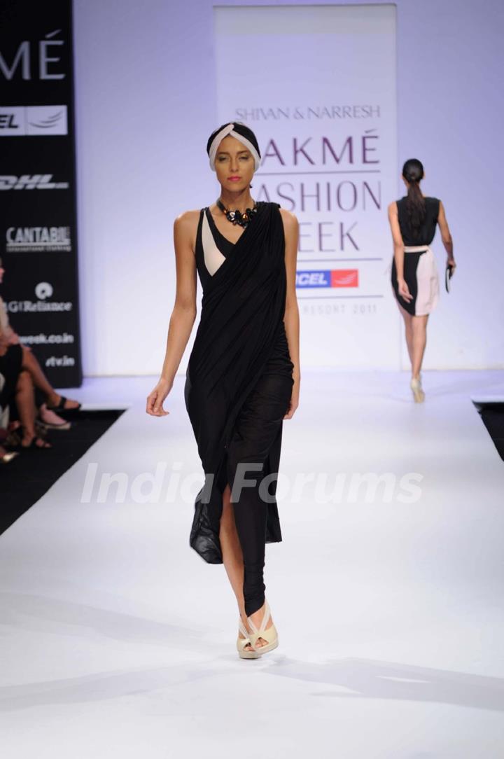 A model showcases a creation by designers Shivan and Narresh at Lakme Fashion Week day 2 in Mumbai. .