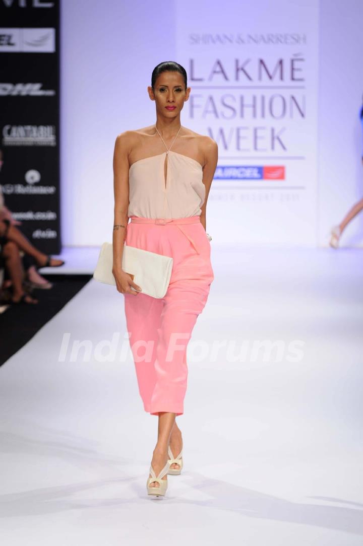 A model showcases a creation by designers Shivan and Narresh at Lakme Fashion Week day 2 in Mumbai. .