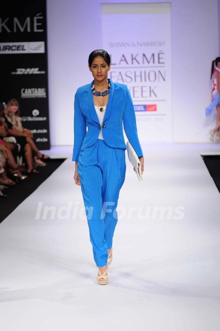 A model showcases a creation by designers Shivan and Narresh at Lakme Fashion Week day 2 in Mumbai. .