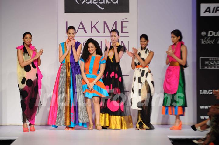 Models walks the runway at the Masaba's show at Lakme Fashion Week day 2 in Mumbai. .